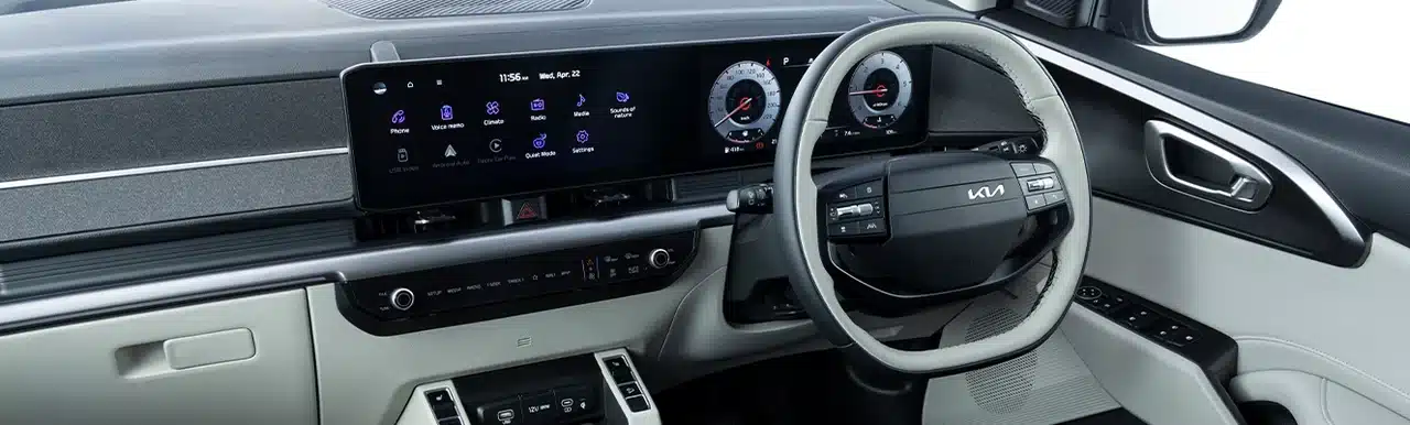 Panoramic infotainment display and digital cluster inside the Kia Carens