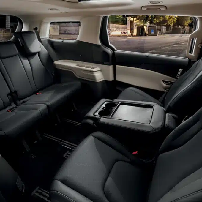 Kia Carnival second-row seating arranged around the folded centre-seat table