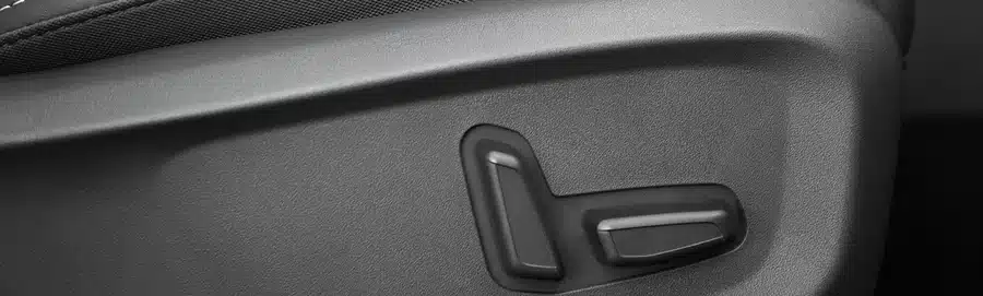 Electric driver seat adjustment controls in the Kia Seltos