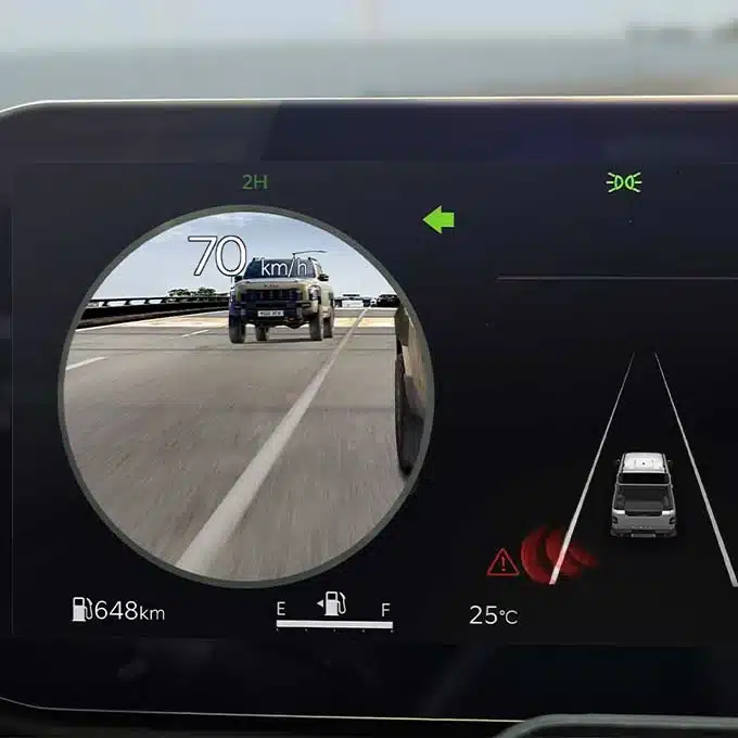 Kia Tasman Blind-Spot View Monitor displaying a camera feed in the instrument cluster
